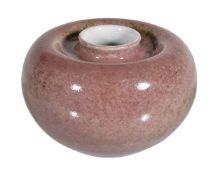 A Chinese 'peachbloom' water pot, the ovoid body with recessed neck, with a glaze of soft crushed