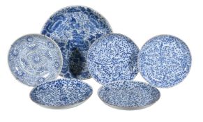 A large Chinese blue and white dish, Kangxi, painted with dense foliage, 39cm diameter; a pair of