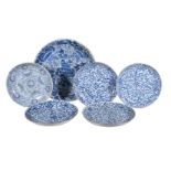 A large Chinese blue and white dish, Kangxi, painted with dense foliage, 39cm diameter; a pair of