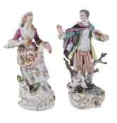 A pair of Meissen models of a gardener and companion, 20th century, blue crossed swords mark, 27cm