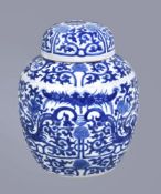 A Chinese blue and white ginger jar and cover, Qing Dynasty, circa 1900, painted with dragons and