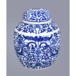 A Chinese blue and white ginger jar and cover, Qing Dynasty, circa 1900, painted with dragons and