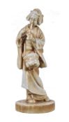 An Unusual White Porcelain Figure, depicting a standing bijin on a rounded base, she wears a