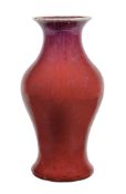 A Chinese Flambé vase, the inverted baluster body with flared neck, with red and purple streaked