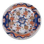 A Chinese Imari large dish, Kangxi, painted with cenral medallion with radiating flowers in