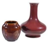 A Chinese copper red vase, of baluster form with cylindrical neck and flared rim, with apocryphal