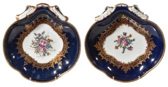 Two similar Worcester blue-ground shell-shaped dishes, circa 1770, the centres painted with floral
