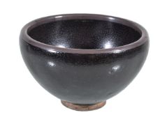 A Chinese 'oil-spot' small bowl, potted with rounded sides supported on a short splayed knife-