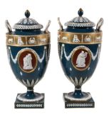 A pair of Wedgwood glazed parian classical urns and covers, late 19th century, sprigged in low