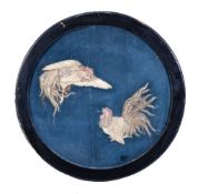 Y A Japanese circular blue Lacquer Plaque, decorated with two fighting cocks inlaid in bone,