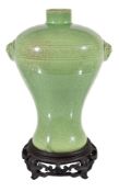 A Chinese crackle-glazed lime green vase, meiping, the bulbous upper section incised with two rows