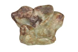 A Chinese green and russet jade 'Scholars Rock', 16cm wide x 12cm high x 6cm deep