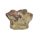 A Chinese green and russet jade 'Scholars Rock', 16cm wide x 12cm high x 6cm deep
