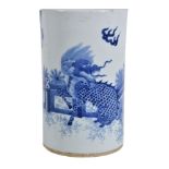 A Chinese blue and white brush vase, painted with a mythical lion and plantain trees, 20cm high