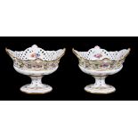 A pair of Meissen pedestal table centre flower-encrusted and pierced baskets, late 19th century,