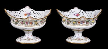 A pair of Meissen pedestal table centre flower-encrusted and pierced baskets, late 19th century,