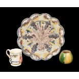Three items of English creamware, circa 1760, comprising:a relief-moulded plate decorated with