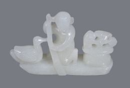 A Chinese white jade ‘boat and goose’ carving, depicting a kneeling boy with paddle and goose and