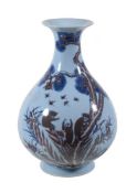 A Chinese blue lavender-ground vase, decorated in blue and white and copper-red with monkeys