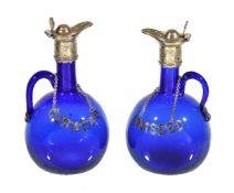 A pair of English blue-glass silver-plate mounted flasks and stoppers, third quarter 19th century,