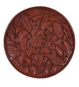 A Chinese cinnabar lacquer dish, in early Ming style, of circular form, the shallow rounded sides