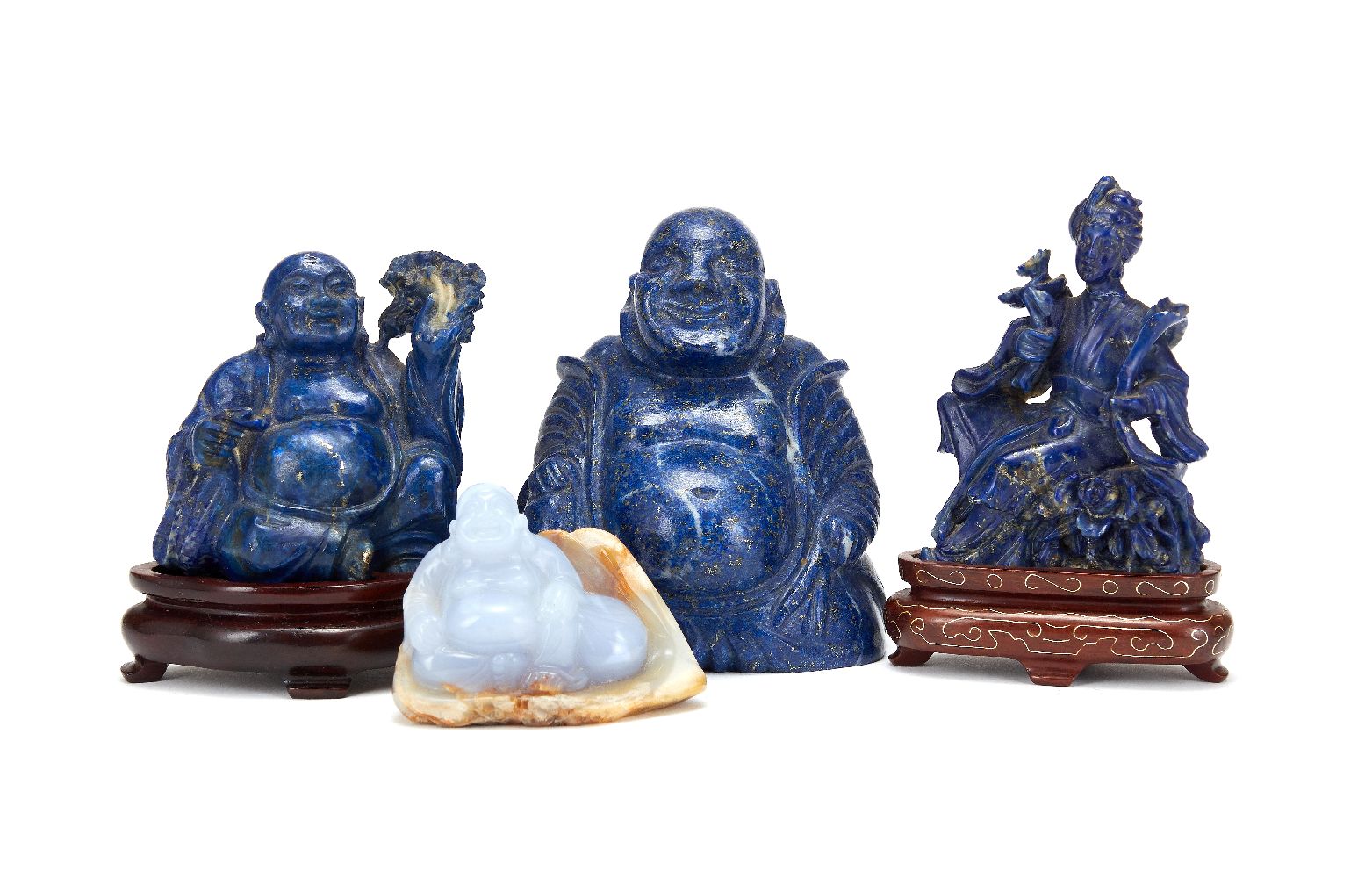 A Chinese Chalcedony carving of a Buddha, carved with light purple coloured stone against a