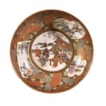 A Japanese Satsuma pottery bowl, of shallow circular form decorated in over glaze enamels and