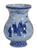 A large Chinese blue and white vase, on a washed blue ground, with nine figures standing in a