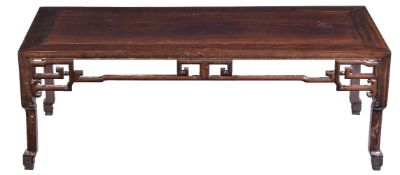 A Chinese hardwood low table, late Qing Dynasty, carved with pierced frieze on all sides, four