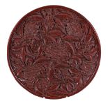 A large Chinese red lacquer tray, in Ming style, of shallow circular form, the interior deeply