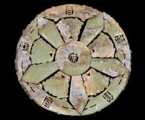 A Chinese celadon white and brown jade archaistic sectional roundel, overall diameter 22cm, fitted