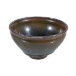 A Jian type 'Hare's Fur' tea bowl, potted with deep sloping walls rising from a short foot ring,