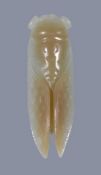 A Chinese celadon and russet jade cicarda, 6.5cm long; a Chinese celadon and russet carved jade