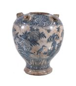 A Safavid blue and white pottery tulip vase, Persia, 17th Century, of baluster form with a central