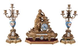 A gilt spelter and Sevres style porcelain mounted figural mantel clock and associated garniture,