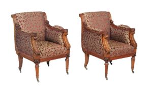 A pair of mahogany and upholstered armchairs in Regency style, 20th century, the design in the