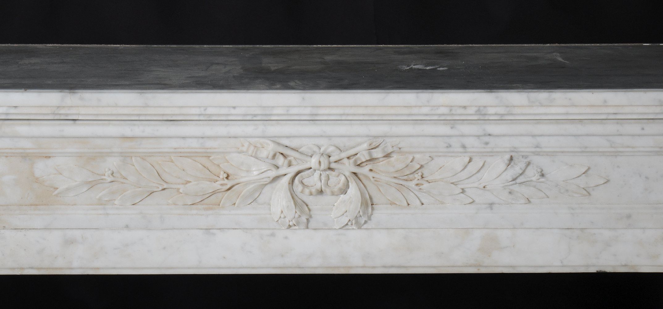 A mottled white marble chimneypiece in Louis XVI style, 19th century, the frieze of crossed laurel - Image 2 of 4