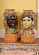 A pair of modern Sicilian Maiolica style figural head jars or planters, adorned with citrus fruit