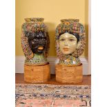 A pair of modern Sicilian Maiolica style figural head jars or planters, adorned with citrus fruit