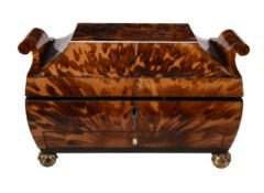 Y A Regency tortoiseshell veneered and ivory strung sewing box, circa 1815, of sarcophagus form