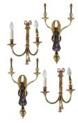 A pair of gilt and patinated twin light wall appliques in Empire taste, second half 20th century,