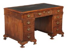 A walnut pedestal desk in mid-18th century style, late 19th century, the writing surface above three