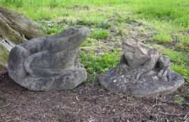 A stone composition model of a toad, naturalistically cast on a rocky base, 43cm high, together with