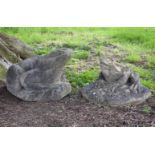 A stone composition model of a toad, naturalistically cast on a rocky base, 43cm high, together with