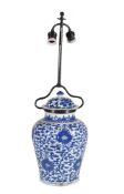 A Chinese blue and white vase and cover, Kangxi, painted with scrolling lotus, adapted as a lamp,