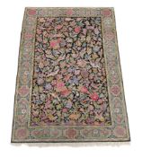 A Kirman rug, approximately 246 x 150cm, together with a small circular rug in Chinese style, and