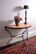 A wrought iron and Sienna marble console table, 20th century, of semi-elliptical outline and on