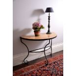 A wrought iron and Sienna marble console table, 20th century, of semi-elliptical outline and on
