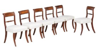 A set of six mahogany dining chairs, 19th century, with recent white calico upholstery,