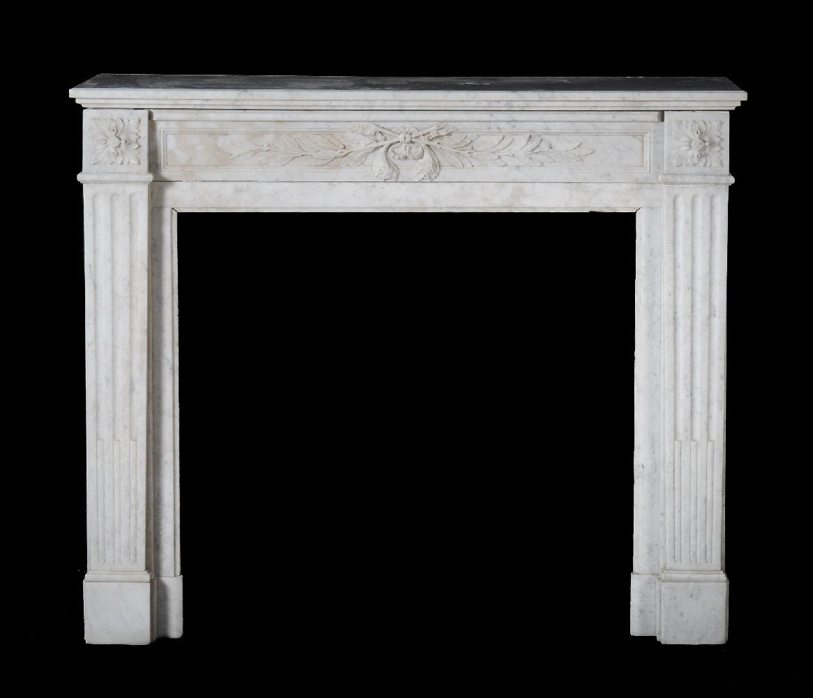 A mottled white marble chimneypiece in Louis XVI style, 19th century, the frieze of crossed laurel